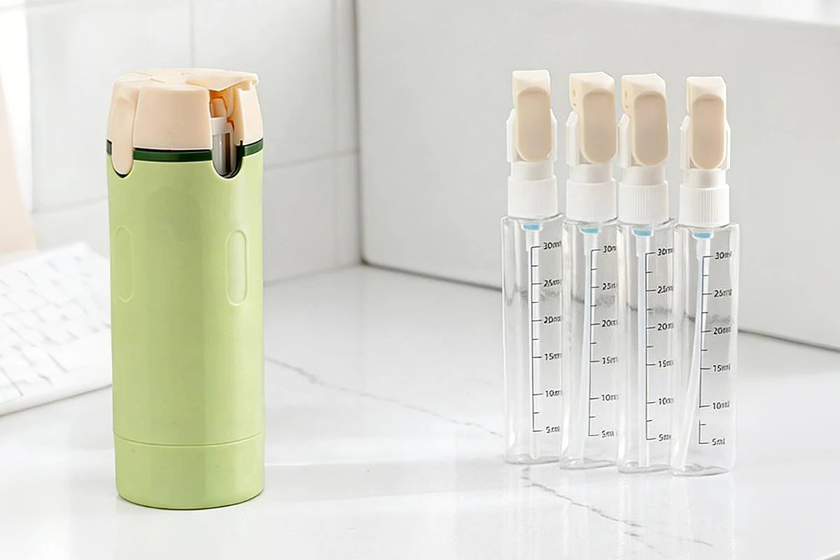 Distributeur 4 en 1 avec flacons de voyage 30 ml