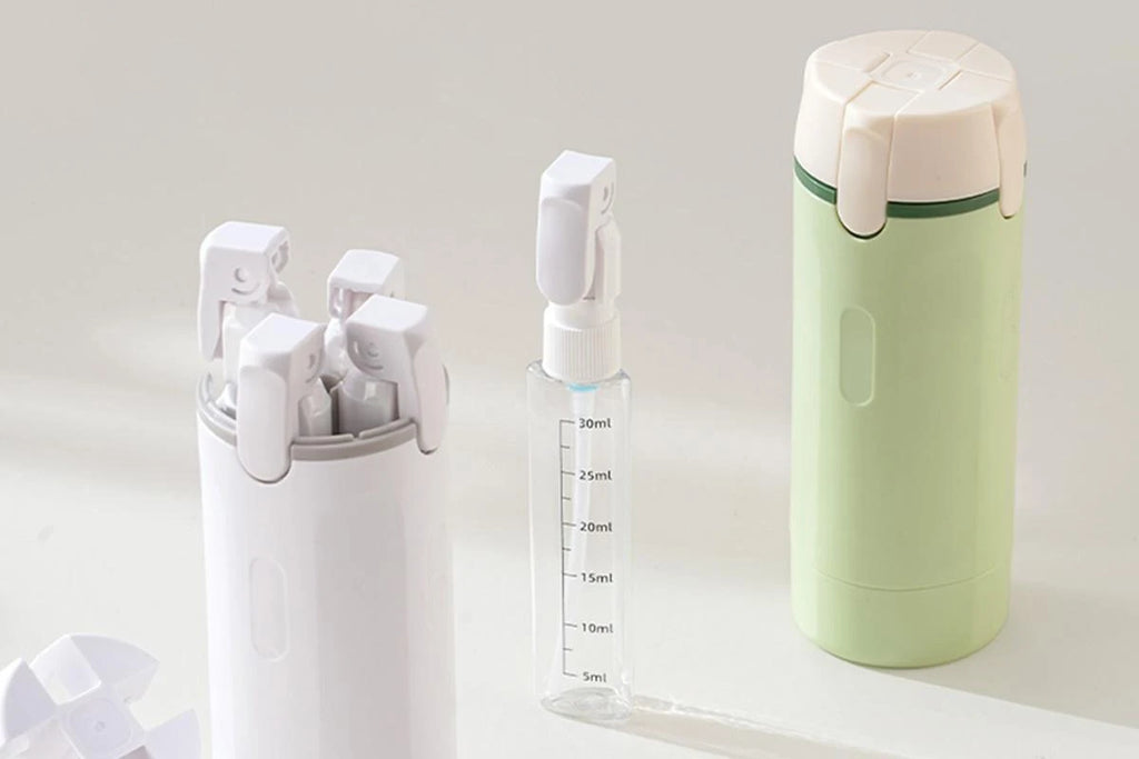 Distributeur 4 en 1 avec flacons de voyage 30 ml